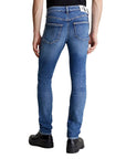 Calvin Klein Jeans Logo Organic Cotton-Blend Distressed Slim & Straight Leg Medium Wash Jeans